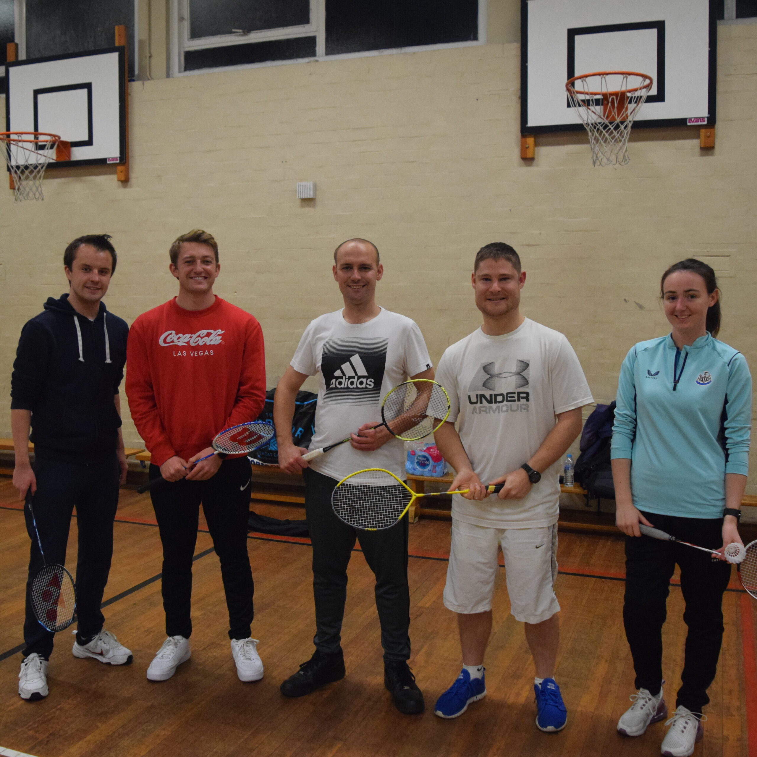 Members of Deaf Awareness North East holding badminton rackets