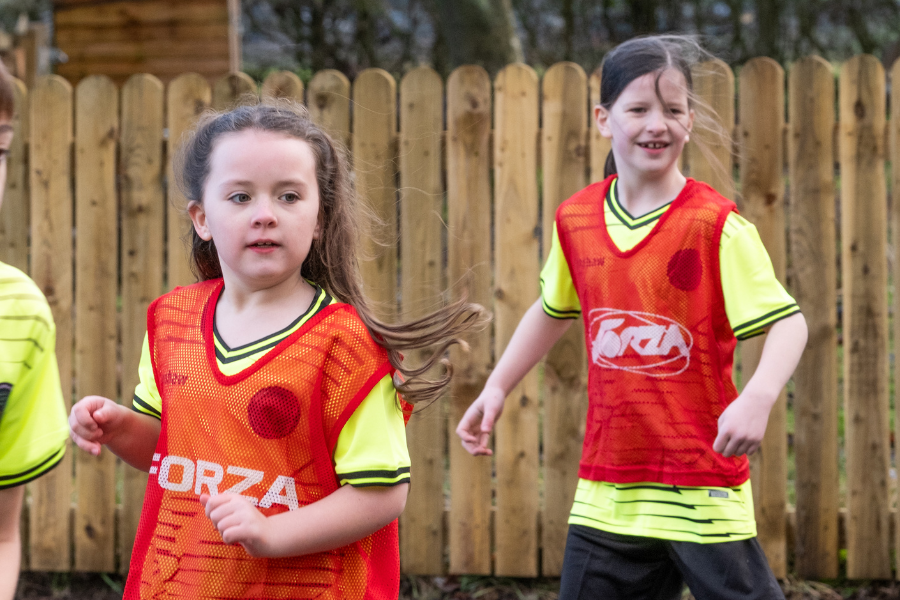 Girls playing football