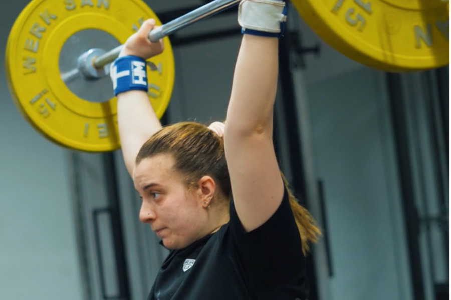 Rise team member doing weightlifting