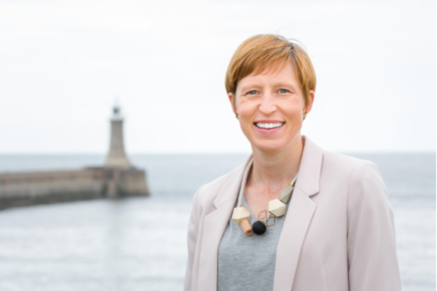 Rise CEO, Clare Morley, pictured in front of pier and lighthouse